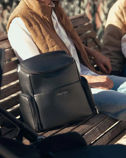 Nuna Essential Diaper Bag-Backpack-Changing Pad With Magnetic Closure-Removable Toiletry Pouch-Back Pocket Unzips Into Trolley Sleeve-Caviar