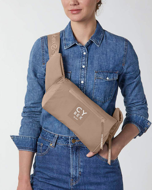 Cybex Coya Baby Carrier-With 3 Carry Positions-Foldable Into Trendy Crossbody Bag-3D Mesh Fabric-UPF 50+ Sun Hood-Waist Belt With Zip Pocket-For 0 to 3Y (3.2 to 15Kg)-Cozy Beige