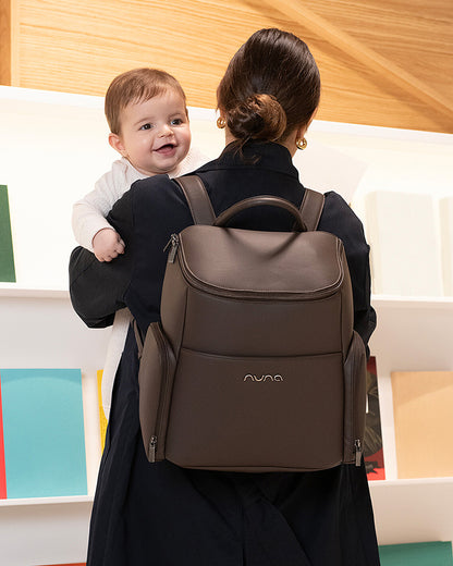 Nuna Essential Diaper Bag-Backpack-Changing Pad With Magnetic Closure-Removable Toiletry Pouch-Back Pocket Unzips Into Trolley Sleeve-Cocoa
