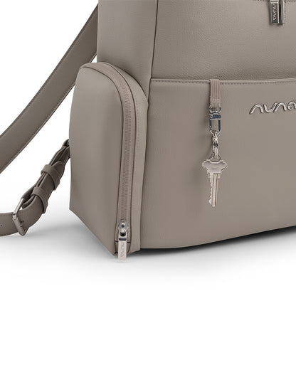 Nuna Essential Diaper Bag-Backpack-Changing Pad With Magnetic Closure-Removable Toiletry Pouch-Back Pocket Unzips Into Trolley Sleeve-Taupe
