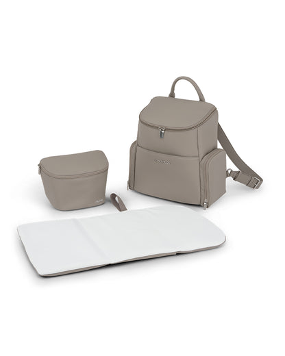 Nuna Essential Diaper Bag-Backpack-Changing Pad With Magnetic Closure-Removable Toiletry Pouch-Back Pocket Unzips Into Trolley Sleeve-Taupe