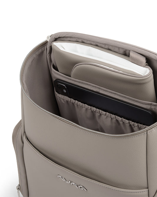 Nuna Essential Diaper Bag-Backpack-Changing Pad With Magnetic Closure-Removable Toiletry Pouch-Back Pocket Unzips Into Trolley Sleeve-Taupe