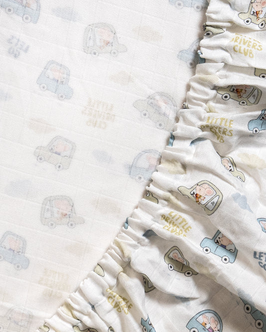 Twingle 100% Organic Muslin Fitted Cot Bedsheet-Generously Sized-Secured All-Round Elastic for Snug Fit-Softens with each Wash-Little Drivers Print-White & Blue-Pack of 1-For Infants
