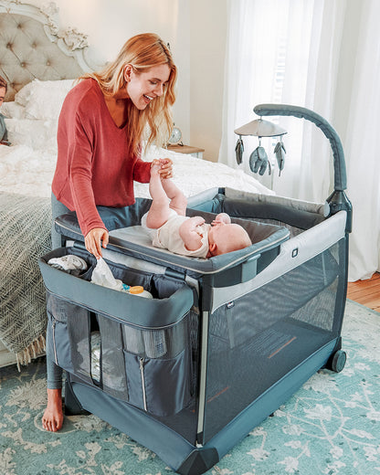 Chicco Lullaby Zip All-in-One Portable Playard-With Detachable Changer & Removable Mattress-With Electronic Toy Bar & Soothing Melodies-Includes Travel Bag-Driftwood